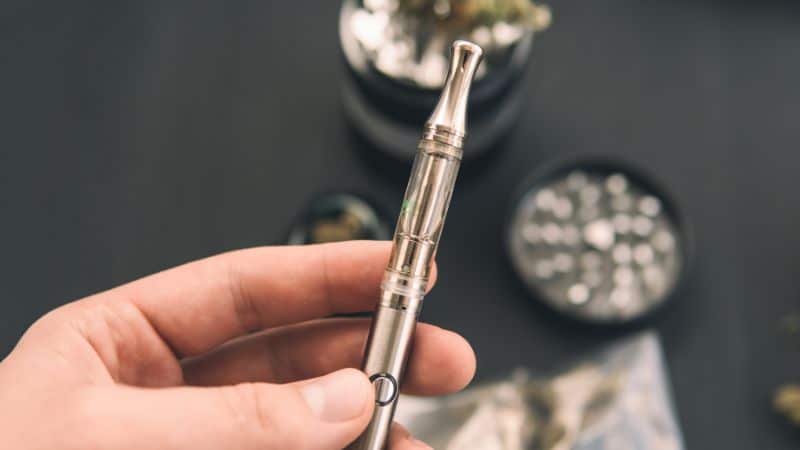 With your dab pen loaded and powered on, press and hold the button while inhaling from the mouthpiece. 