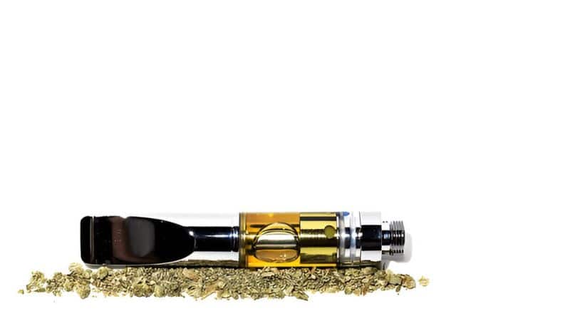 Load a tiny piece of shatter into the chamber of a dab pen. Press the button, let the coil heat up, and inhale gently.